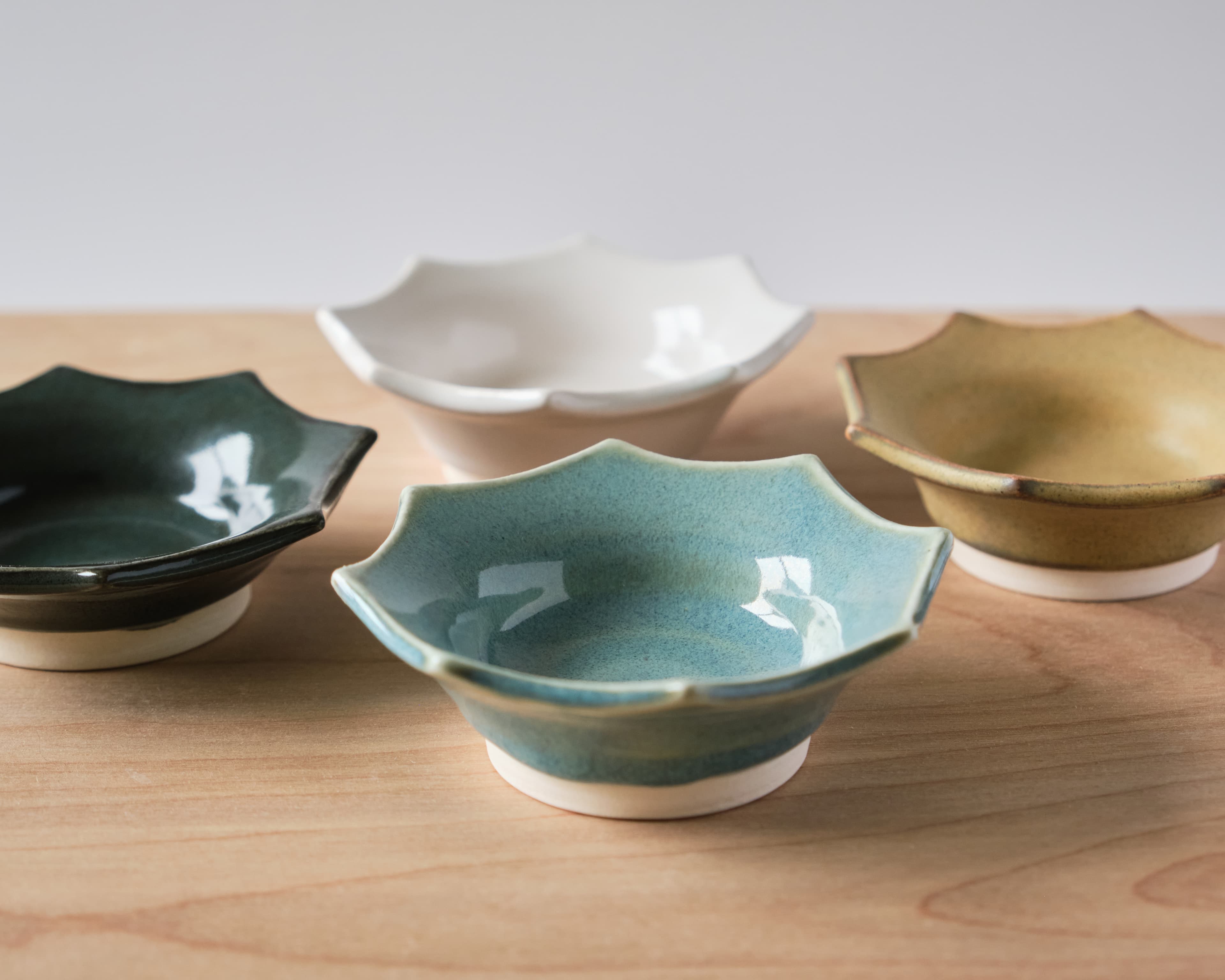Four handmade ceramic bowls arranged together